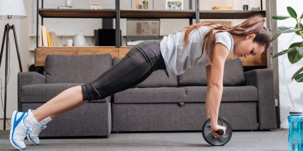 The 5 Fitness Products That Will Help You Get in Shape from Home in 2025 13 a woman doing push ups